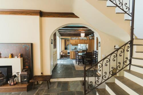 an archway leading to a dining room and living room at The Beach House in Néa Péramos