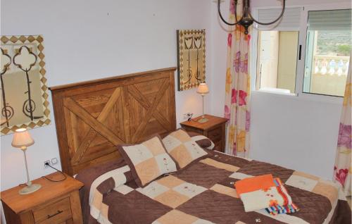 A bed or beds in a room at Amazing Apartment In Isla Plana With House Sea View