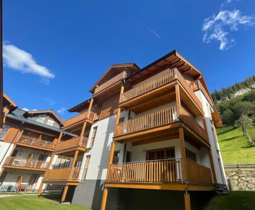 a building with balconies on the side of it at Claudia 2 by SMR Rauris Apartments - inc Spa and National Summercard - near Gondola in Rauris