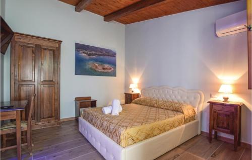 מיטה או מיטות בחדר ב-Villa Ginestra