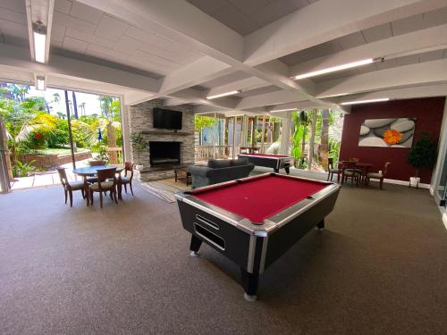 a living room with a pool table in it at C112 - Pier Pleasure in Oceanside