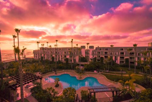 a view of the pool at the resort at sunset at D313 - Sea Blue in Oceanside