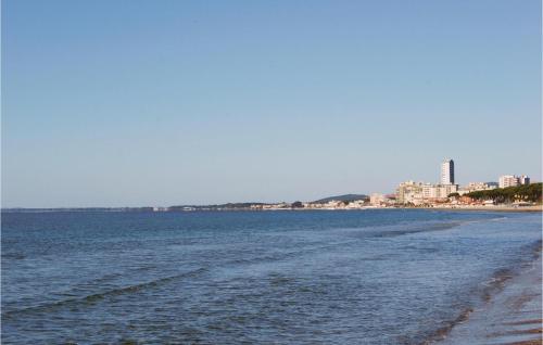 a view of a beach with a city in the background at Sughereto 2 in Caldana