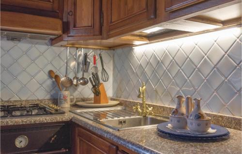 a kitchen with a sink and a counter top at Gorgeous Home In Bagni Di Lucca Lu in Bagni di Lucca