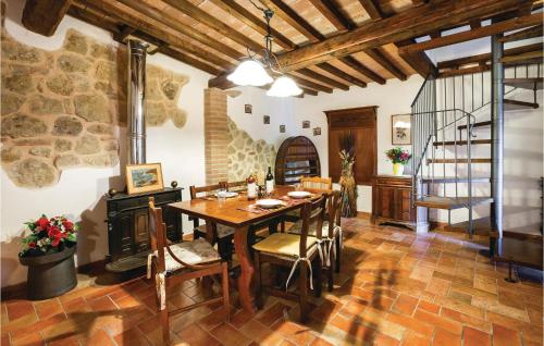 a dining room with a table and a fireplace at I Gigli in Ulignano