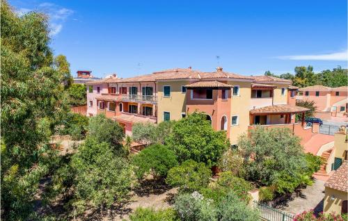 a group of buildings with trees in the foreground at Lovely Apartment In Orosei With Wifi in Orosei