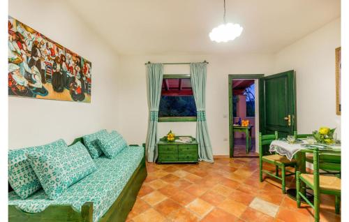 a living room with a couch and a table at Lovely Apartment In Orosei With Wifi in Orosei