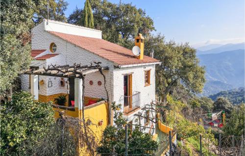 a small house on the side of a hill at Awesome Cottage In Algatocín With Wifi in Algatocín