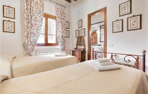 מיטה או מיטות בחדר ב-La Scuderia-podere Moricci