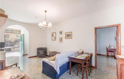 a living room with a table and a couch at Vigna Marengo in Varese Ligure