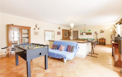 a room with a ping pong table and a living room at Villa Gagliardi in Cerreto Sannita