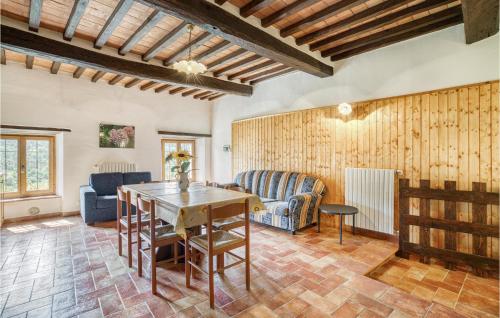 a living room with a table and a couch at Le Caselle in Cortona