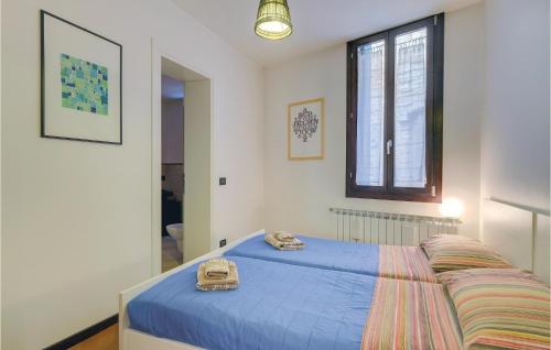 a bedroom with a bed with towels on it at Beautiful Apartment In Venezia -ve- With 2 Bedrooms And Wifi in Venice