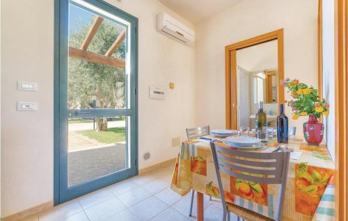 a dining room with a table and a window at Lilybeo in Case Campanella