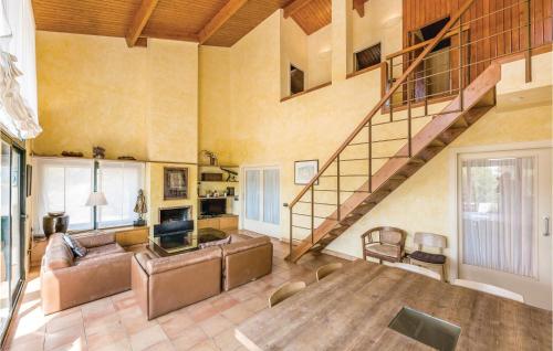 a living room with a staircase and a couch at Casa Oliver in Capmany