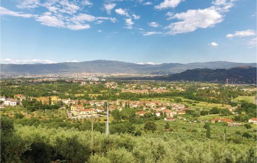 a view of a city with mountains in the background at Casa Al Vento Near Arezzo in Battifolle