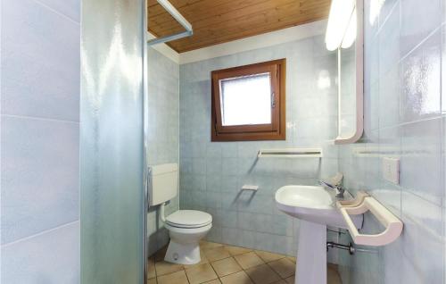 a bathroom with a toilet and a sink at Novamiramare 2 in Belvedere
