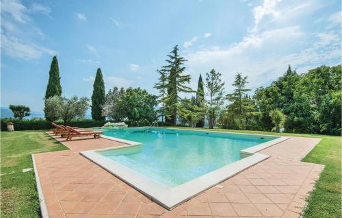 a swimming pool in a yard with a bench at Villa Sangelo in Collescipoli