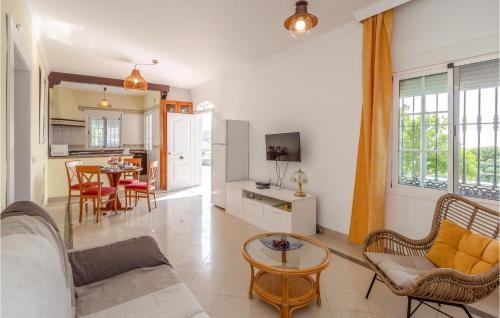 a living room with a couch and a table at Nice Home In Velez - Malaga With Wifi in Vélez-Málaga