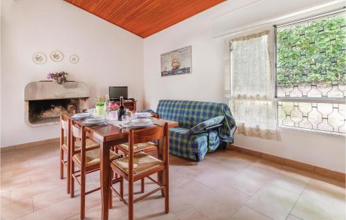 a living room with a table and a couch at Casa Laura 1 in Lignano Sabbiadoro