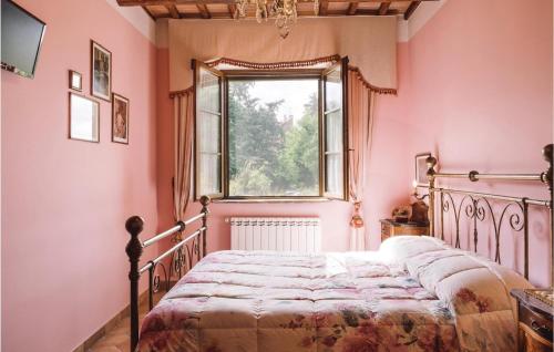 a bedroom with pink walls and a bed with a window at Casale S, Giacomo in Castel del Piano