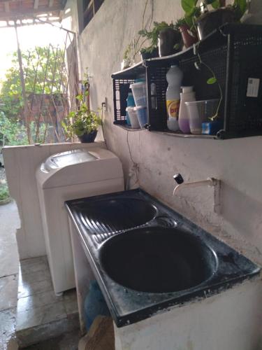 a bathroom with a sink and a toilet at Quarto Bem vindo in João Pessoa