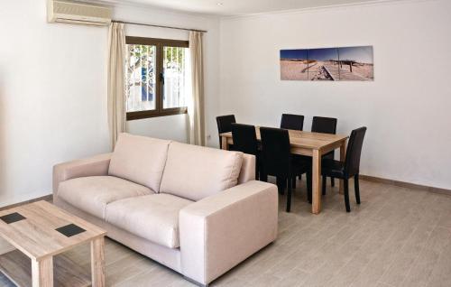 a living room with a couch and a table at Casa Villa Carla in Palma de Mallorca