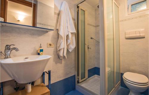 a bathroom with a toilet and a sink and a shower at Gelso Blu in Furore