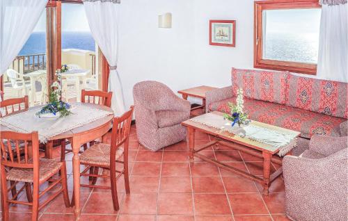 a living room with tables and chairs and a couch at Trilo 6 in Cuile Pazzoni
