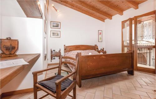 a bedroom with a bed and a desk and a chair at Ca De Gasper in Ballabio