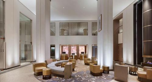 a lobby with couches and tables and chairs at The Clift Royal Sonesta San Francisco in San Francisco