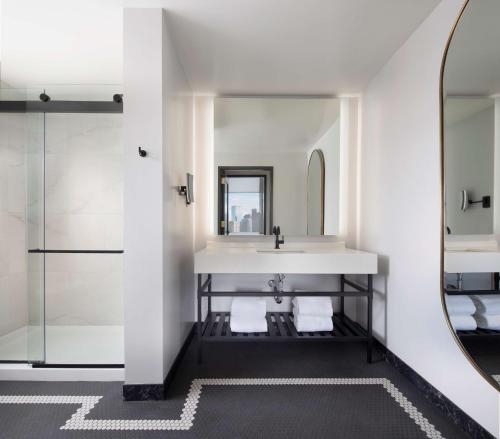 a bathroom with a sink and a mirror at The Clift Royal Sonesta San Francisco in San Francisco