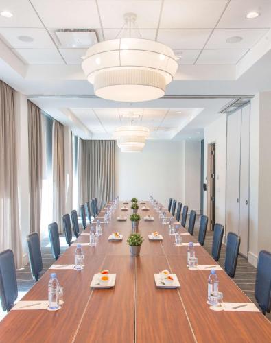 a large conference room with a long table and chairs at Sonesta Fort Lauderdale Beach in Fort Lauderdale