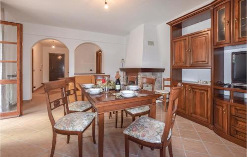 a kitchen with a wooden table and chairs and a dining room at Casa Giovanni in Tavarone