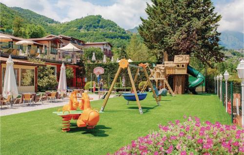 a park with a playground with a slide and swings at Residence Le Rose in Tremosine Sul Garda