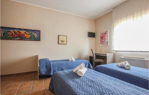 En eller flere senger på et rom på Villa Rossana