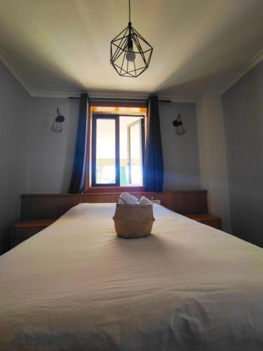 a bedroom with a large bed with a window at Albergue Villa San Clemente in Tui