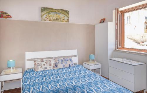 a small bedroom with a bed and a window at Casa Pirato in Modica