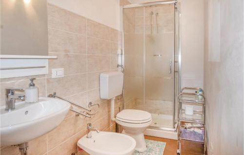 a bathroom with a toilet and a sink and a shower at Casa Pirato in Modica