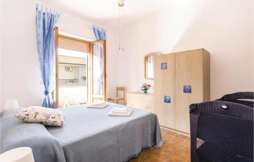 En eller flere senger på et rom på Villa Silvana