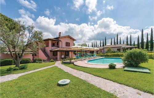 a large house with a swimming pool in a yard at Lavanda in Montorgiali