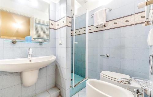 a bathroom with a sink toilet and a glass shower at Paladino 1 in Montecarlo