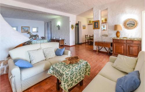 a living room with a couch and a table at Villa Antica in Stalettì