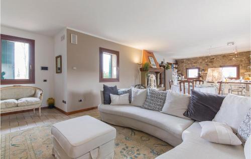 a living room with a white couch and a table at Casa Bellavista in Teolo