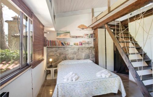 a small room with a bed and a staircase at Casa Stranges in Copanello