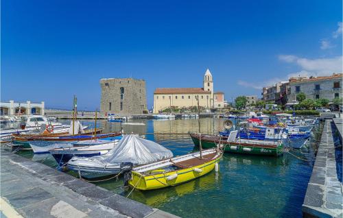a group of boats are docked in a harbor at Casa Grecale in Acciaroli