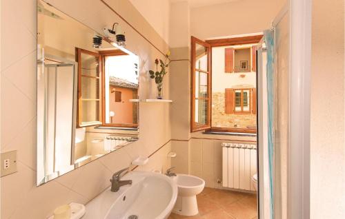 a bathroom with a sink and a toilet and a mirror at Casale Del Borgo 6 in Querce