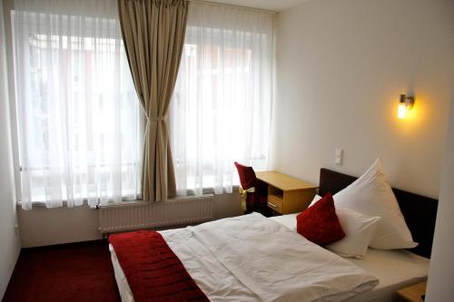 Postel nebo postele na pokoji v ubytování Hotel Gemini