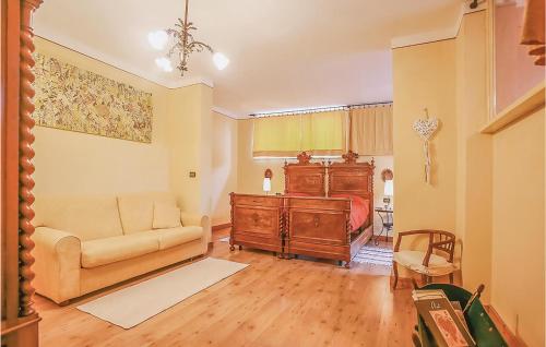 a living room with a couch and a bed at Il Fienile in Portacomaro
