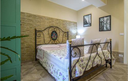 a bedroom with a wrought iron bed in a room at Prato Bello in Fucecchio